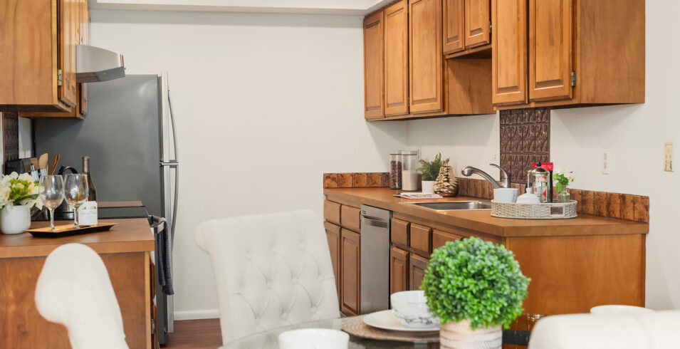 Contemporary kitchen featuring high-end appliances and sleek design in a North Seattle condo