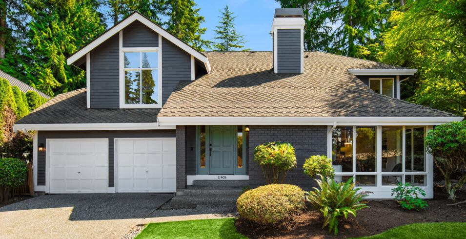 Kirkland Highlands home for sale at 11405 NE 104th St Kirkland WA 98033, gray two story with white trim and two car garage
