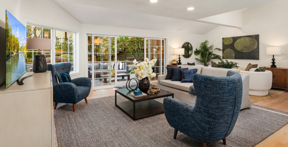 Family room with French style windows opening to back deck in Kirkland Highlands home for sale