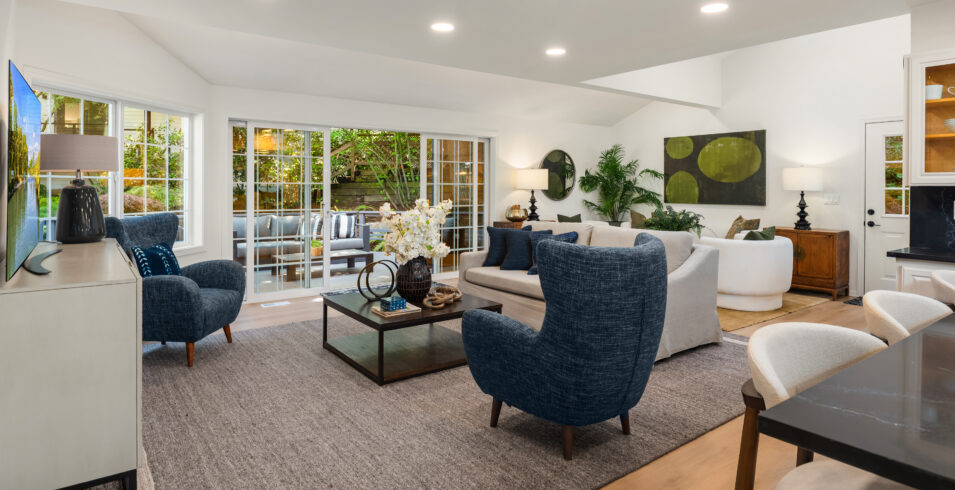 Wide view of family room with staged seating and views to the deck in Kirkland Highlands home