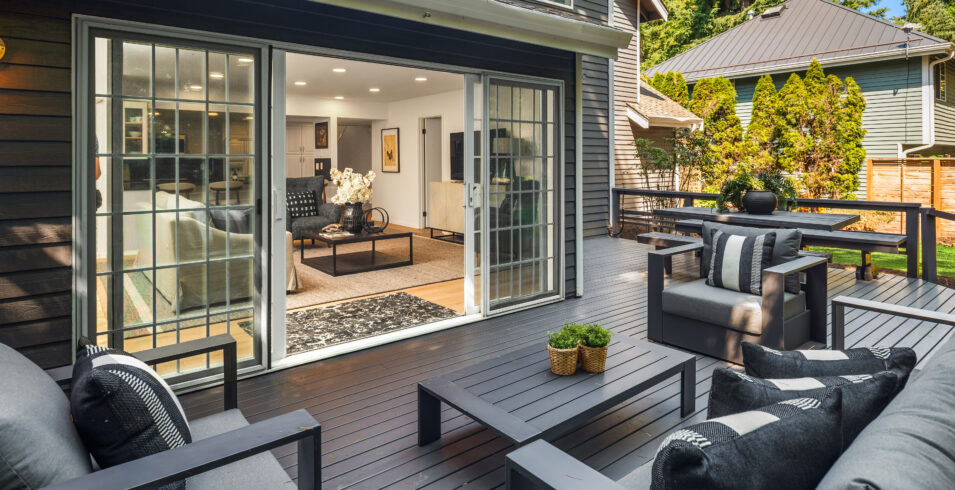 Deck with large sliding doors opening into family room of Kirkland Highlands home