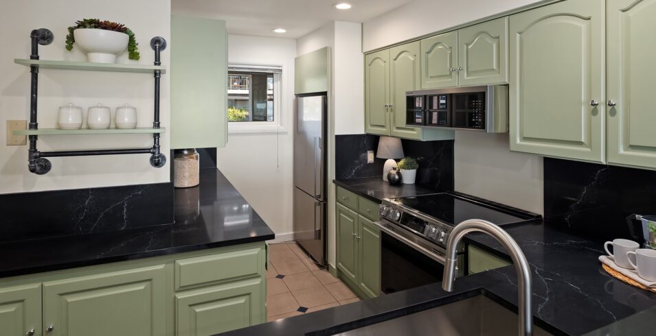Kitchen sink with gooseneck faucet and open shelving