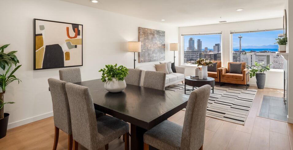 Open dining and living room with downtown Seattle views