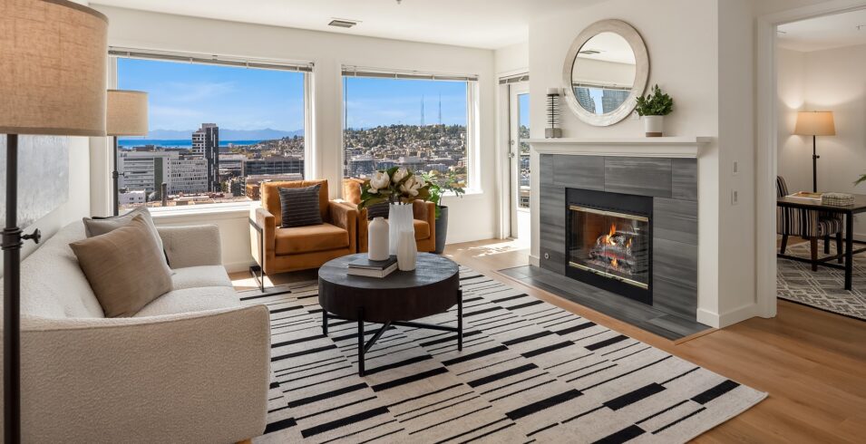 Living room with gas fireplace and the interior stair to the upper level