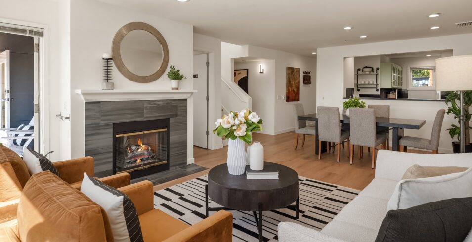 Living room fireplace open to the kitchen