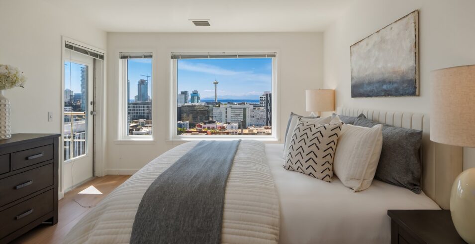 Primary suite with skyline view from the bed
