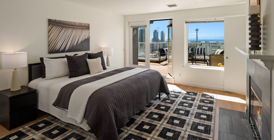 Upper-level primary bedroom with city view